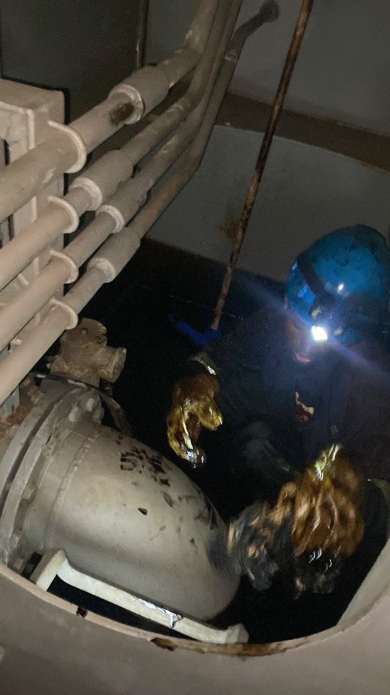Technician inside a tank